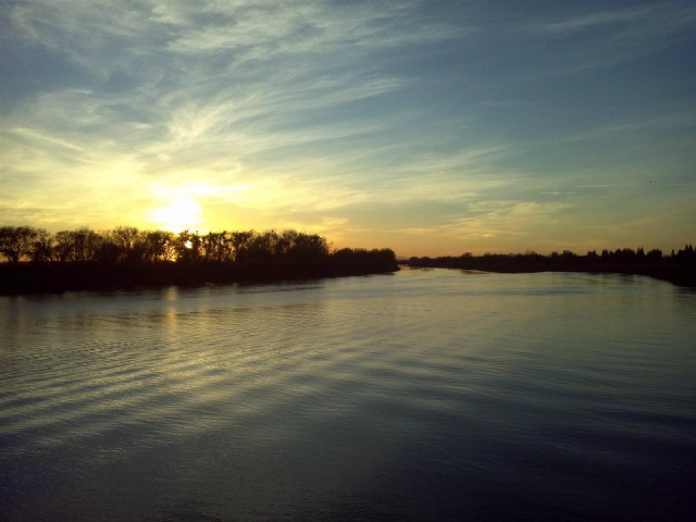 Sunset on the river. View is from the Freeport Water Intake Facility, looking up river. Accessible from Garcia Bend Park bike path.