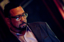 Poet Malik Saunders at a reading during Poetry Week.  13th floor, Elks Temple.