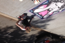 Rtist creating a beautiful piece on J Street.