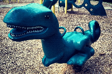 T- Rex playground rocker at Campus Hills