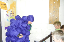 Dr. Chaussee dresses like a grape as part of the incentive for Grace Abbott's fundraiser.  The Abbott families raised over $13,000.
