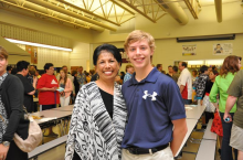 Mrs. Martin, the beloved counselor at Andersen Middle School, with Wolf Lucas at 8th Grade Recognition Night.  
