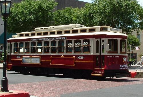 Vintage looking trolly to ride around on and take people to and from nearby neighborhood stops.